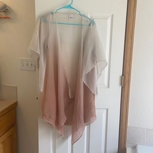 Cream pink colored cardigan.